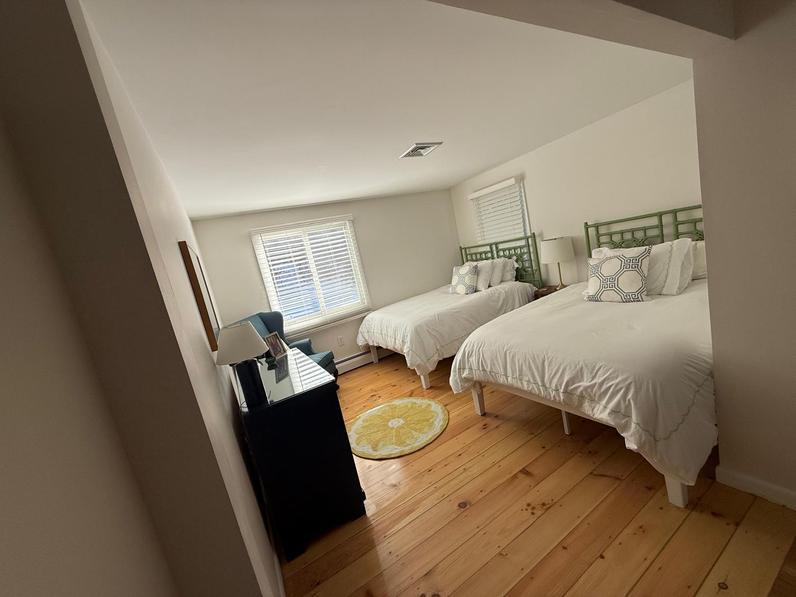 Twin bedroom with fresh linens after a residential cleaning