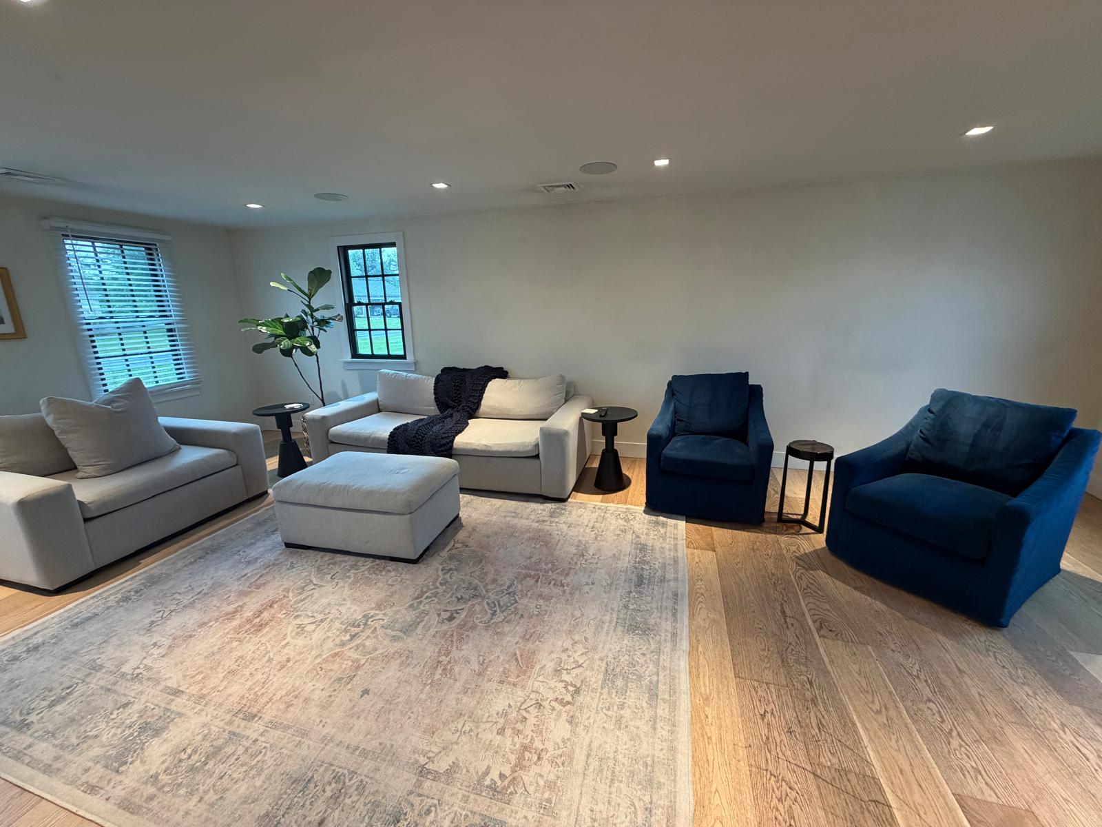 Living room with sofas and armchairs cleaned and arranged