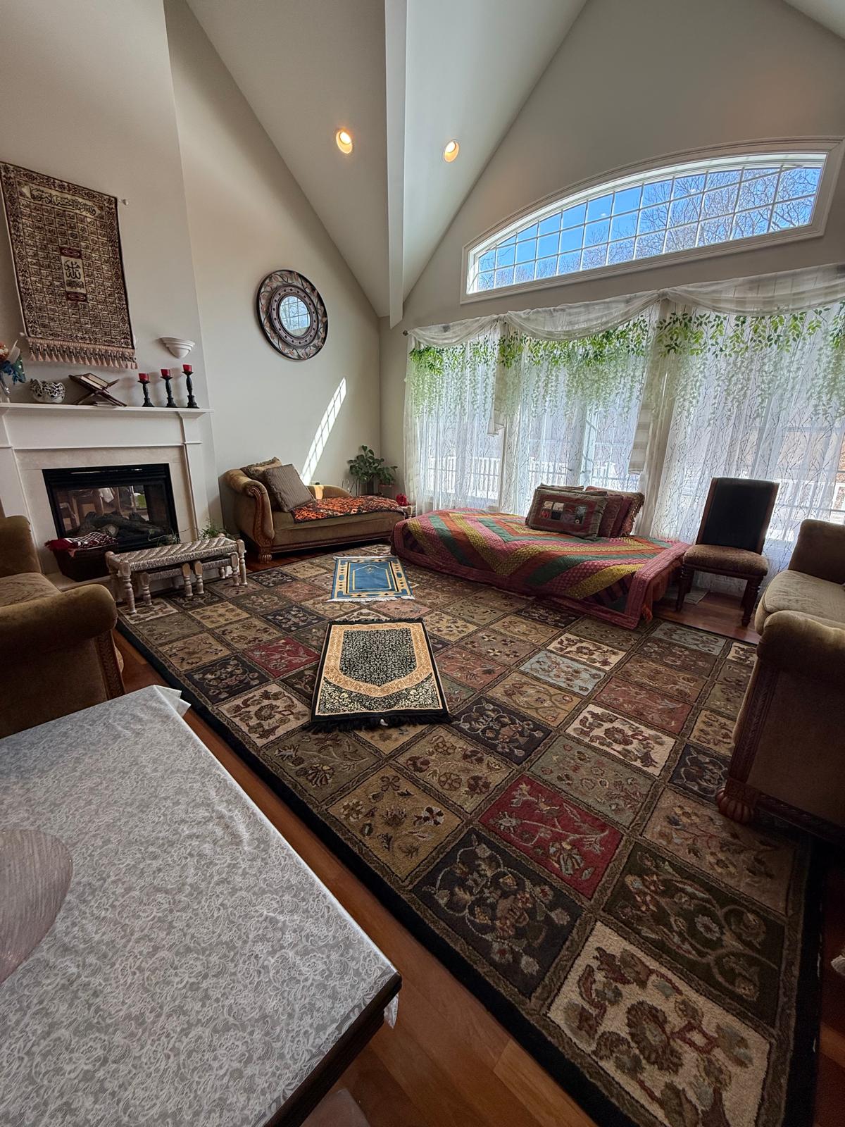 Vaulted living room with fireplace detailed and dust-free