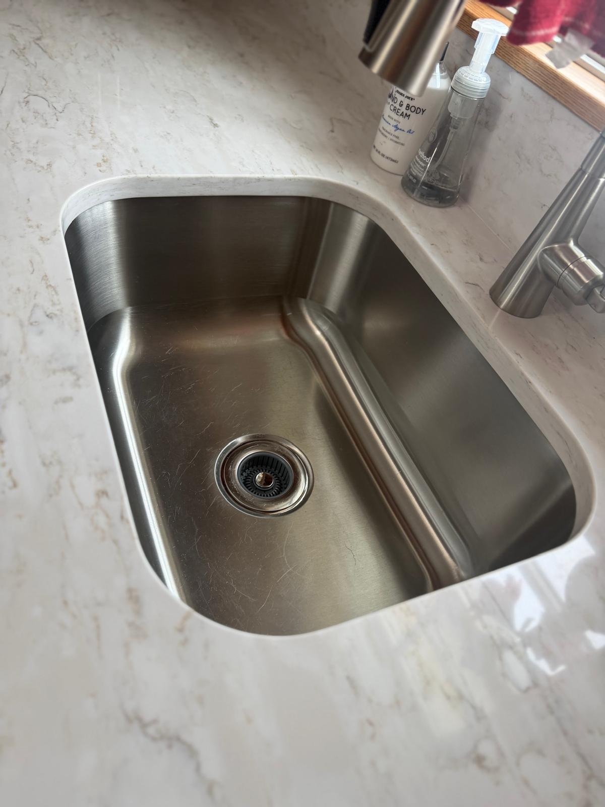 Stainless steel sink scrubbed to a shine