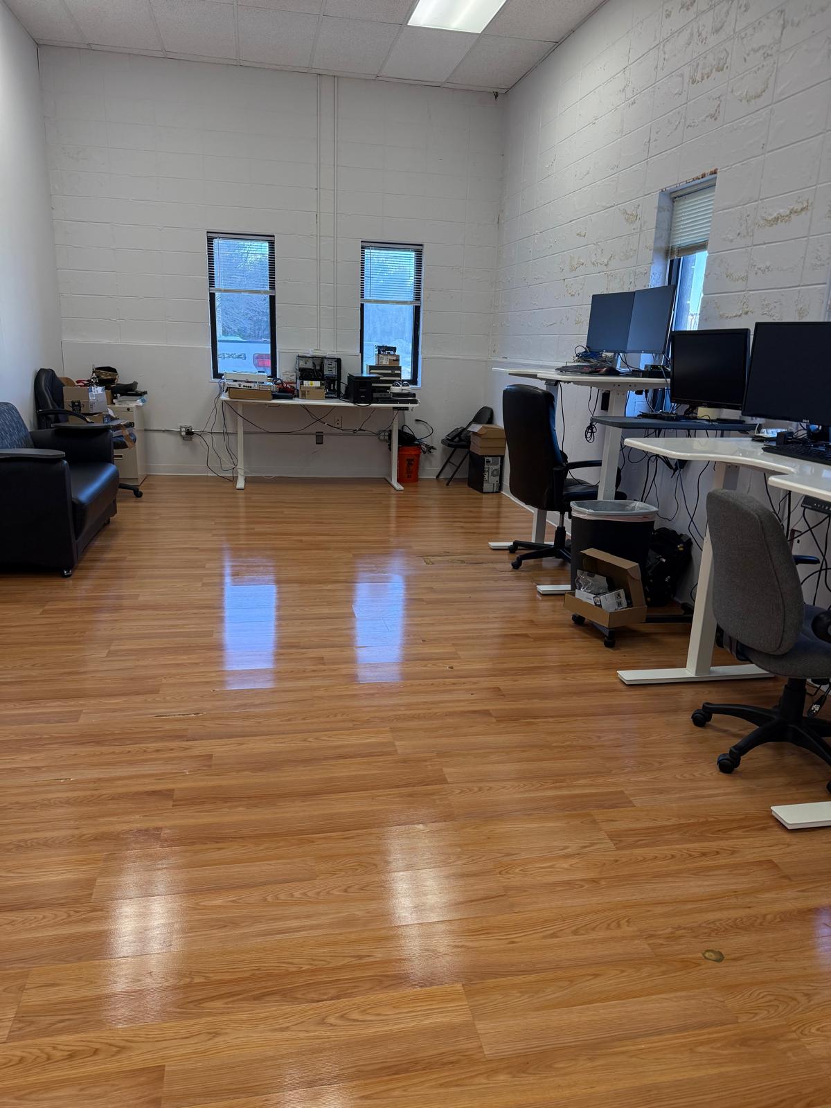 Office space with hardwood floors mopped and polished